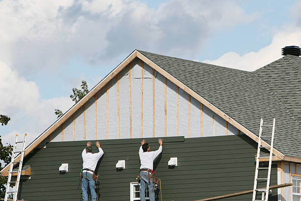 Professional Siding Contractor technician working in Olivia, MN